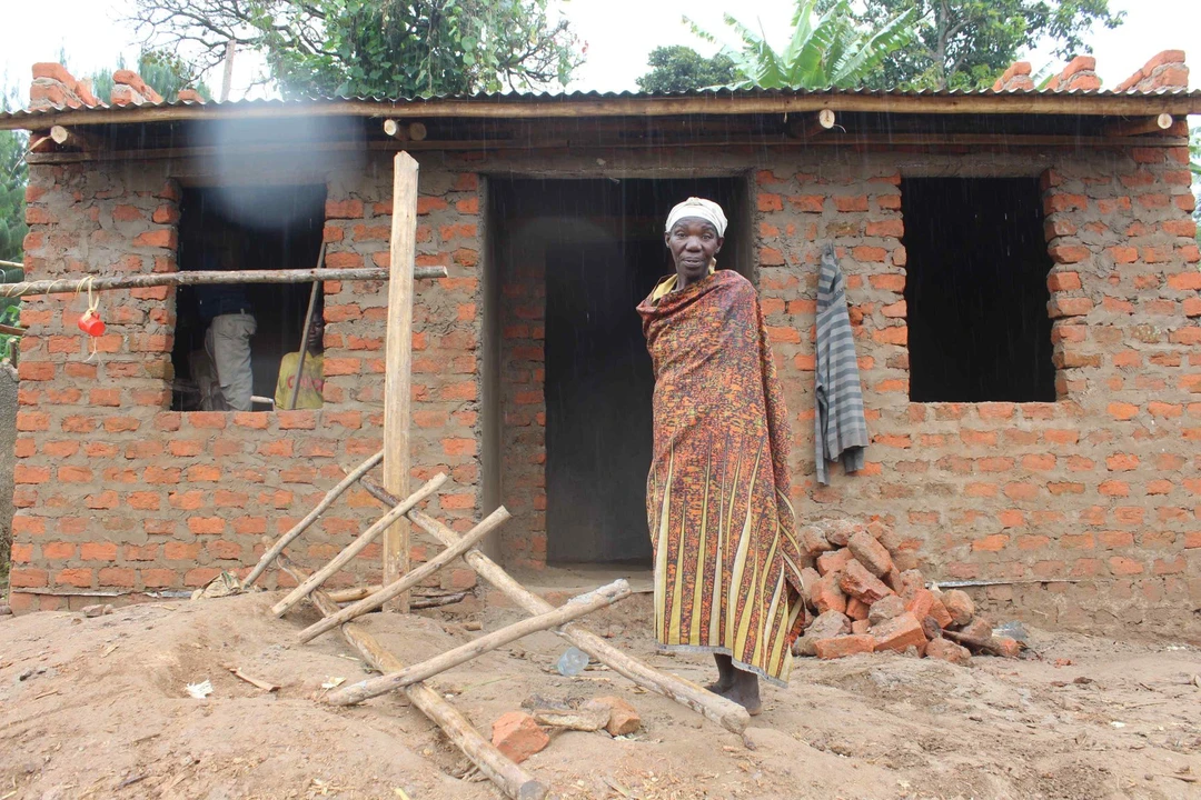 Jeniffer standing infront of her new house